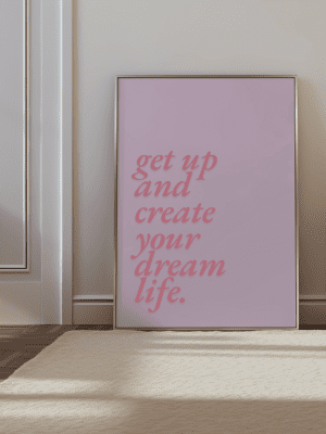 Framed Get Up and Create Your Dream Life poster, displayed in a modern home setting.