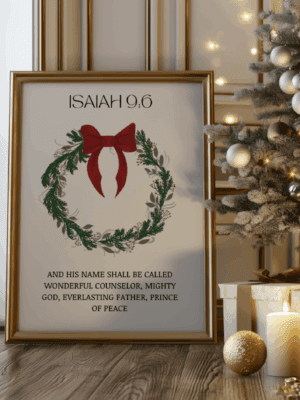 Framed art print of a festive Christmas wreath with a red bow, featuring the Bible verse Isaiah 9:6: "Wonderful Counselor, Mighty God, Everlasting Father, Prince of Peace."