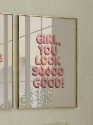 A framed wall art print featuring the text Girl You Look So Good in 3D pink bubble letters on a neutral beige background.